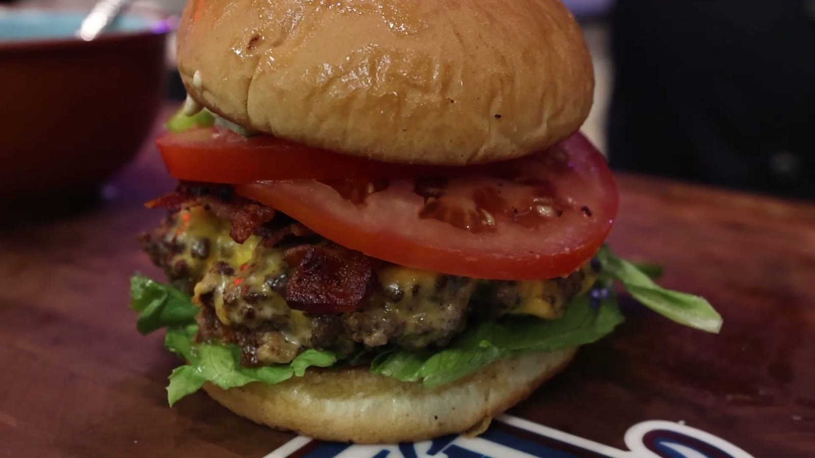 Texas-style double bacon jalapeno cheeseburger stacked with tomato, thick-cut bacon, melted American cheese and green leaf lettuce on a butter-toasted bun